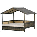 Cama de ratán exterior, con base elevada, techo inclinado y espacio bien ventilado e impermeable